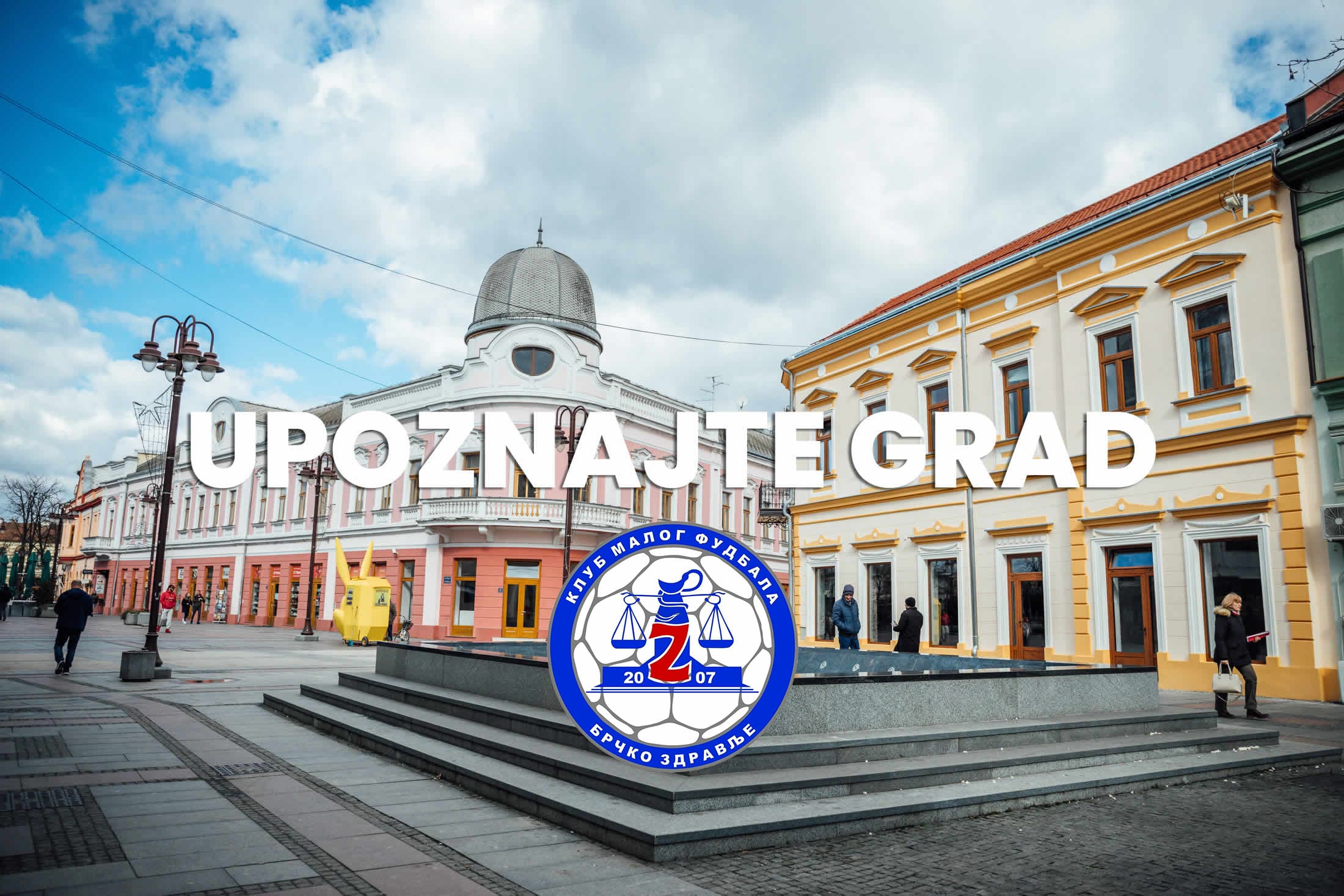 Centar Brčkog sa grbom KMF Brčko Zdravlje i natpisom Upoznajte grad